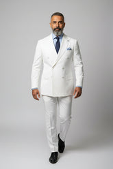 Man wearing a tailored white double-breasted dinner suit with peak lapels.